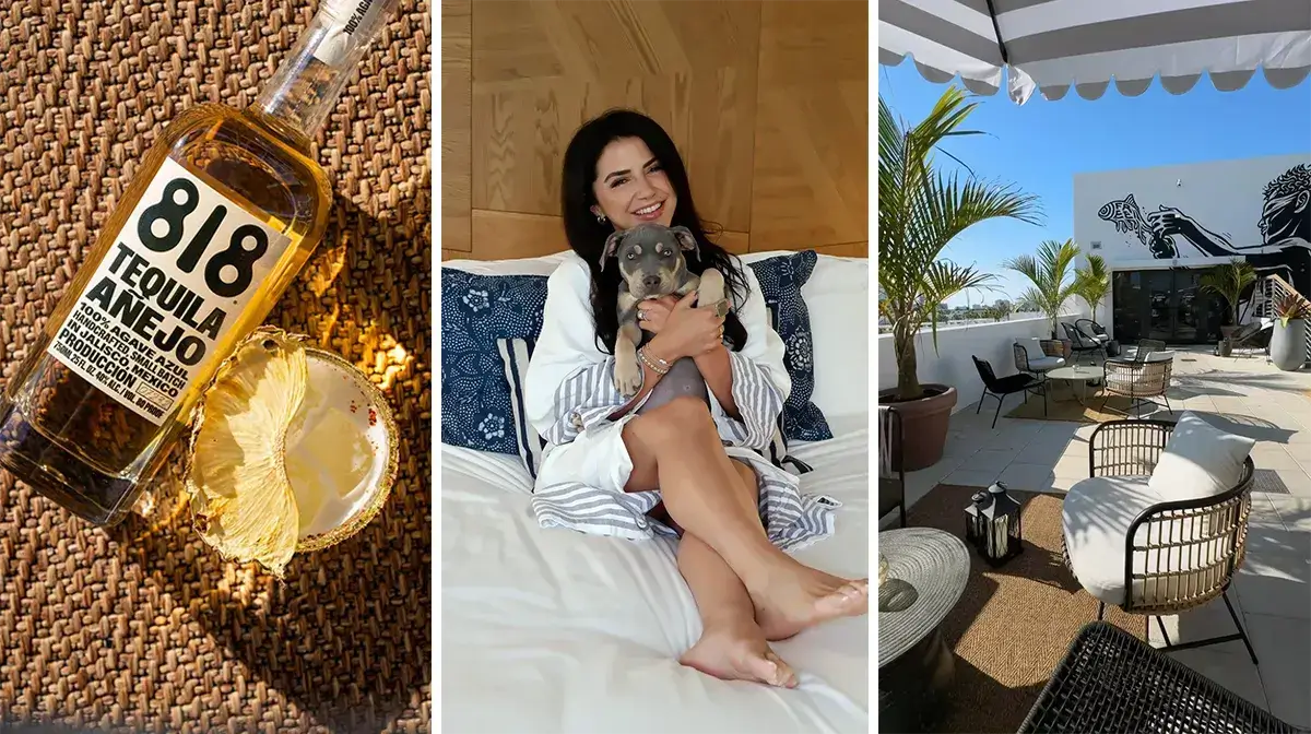 Bottle of 818 Tequila Añejo with a dried pineapple garnish next to a woman holding a puppy on a bed, and an outdoor patio with palm trees.