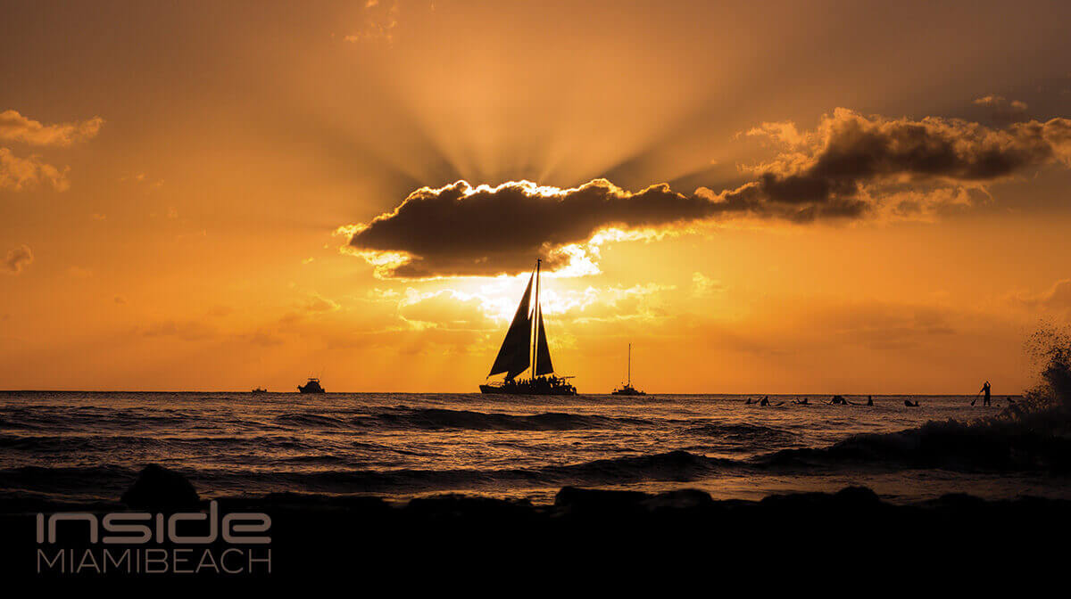 Small boat on tranquil waters at sunset in the Florida Keys, showcasing the region's serene beauty