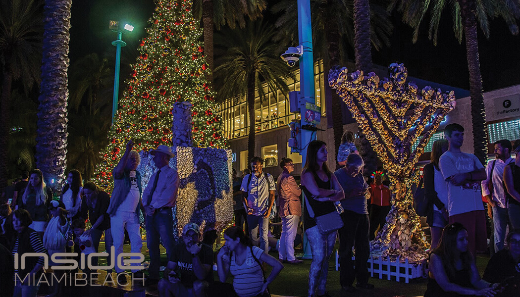 Crowds enjoying Lincoln Road's festive Christmas lights at night