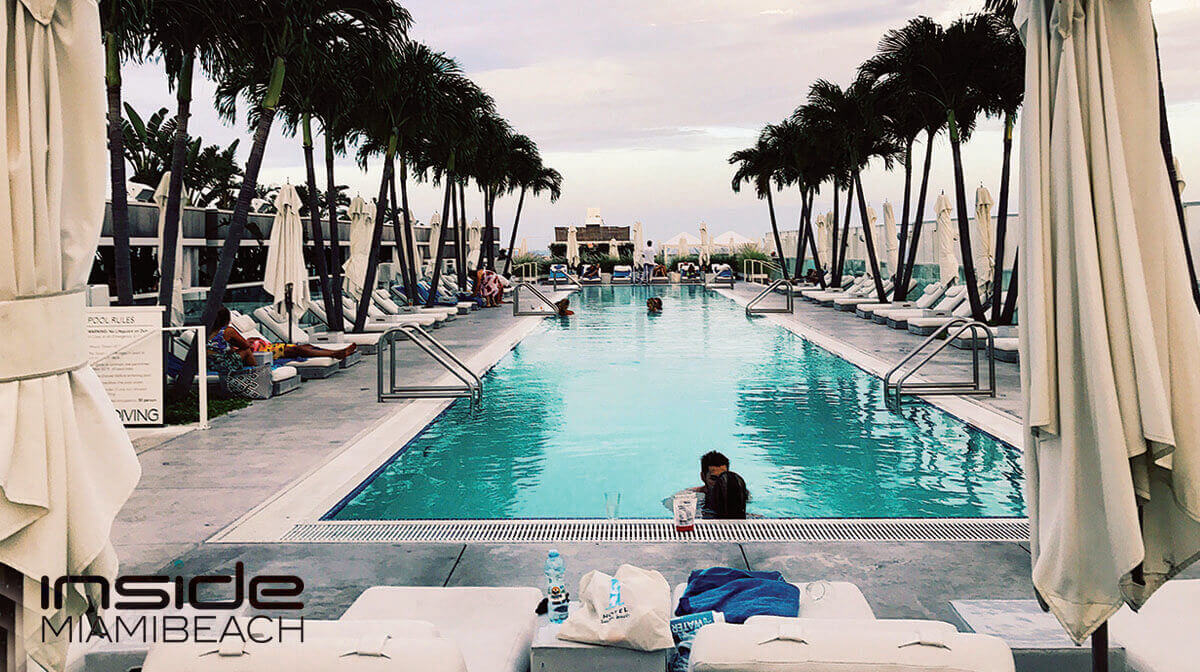 Sunlit swimming pool with a modern design at the 1 Hotel South Beach