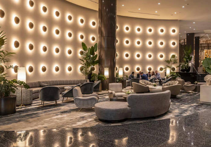 The Ritz-Carlton’s beachfront, showing guests enjoying the pristine sandy beach